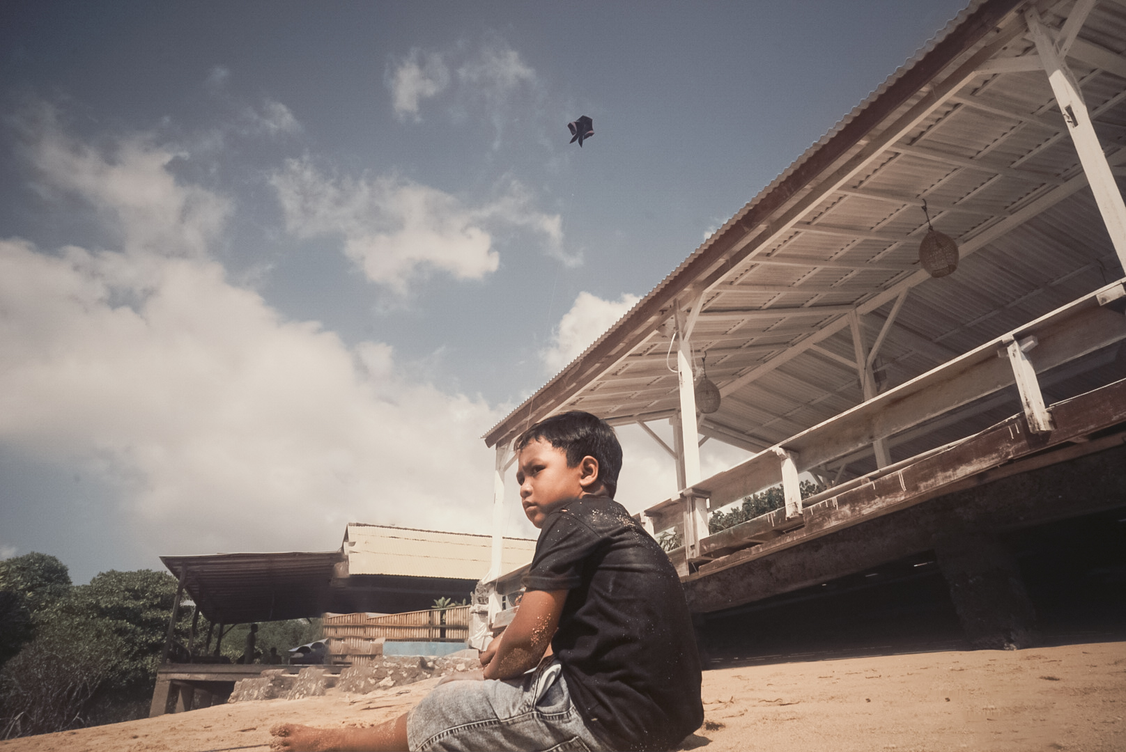 Boy sitting on beach