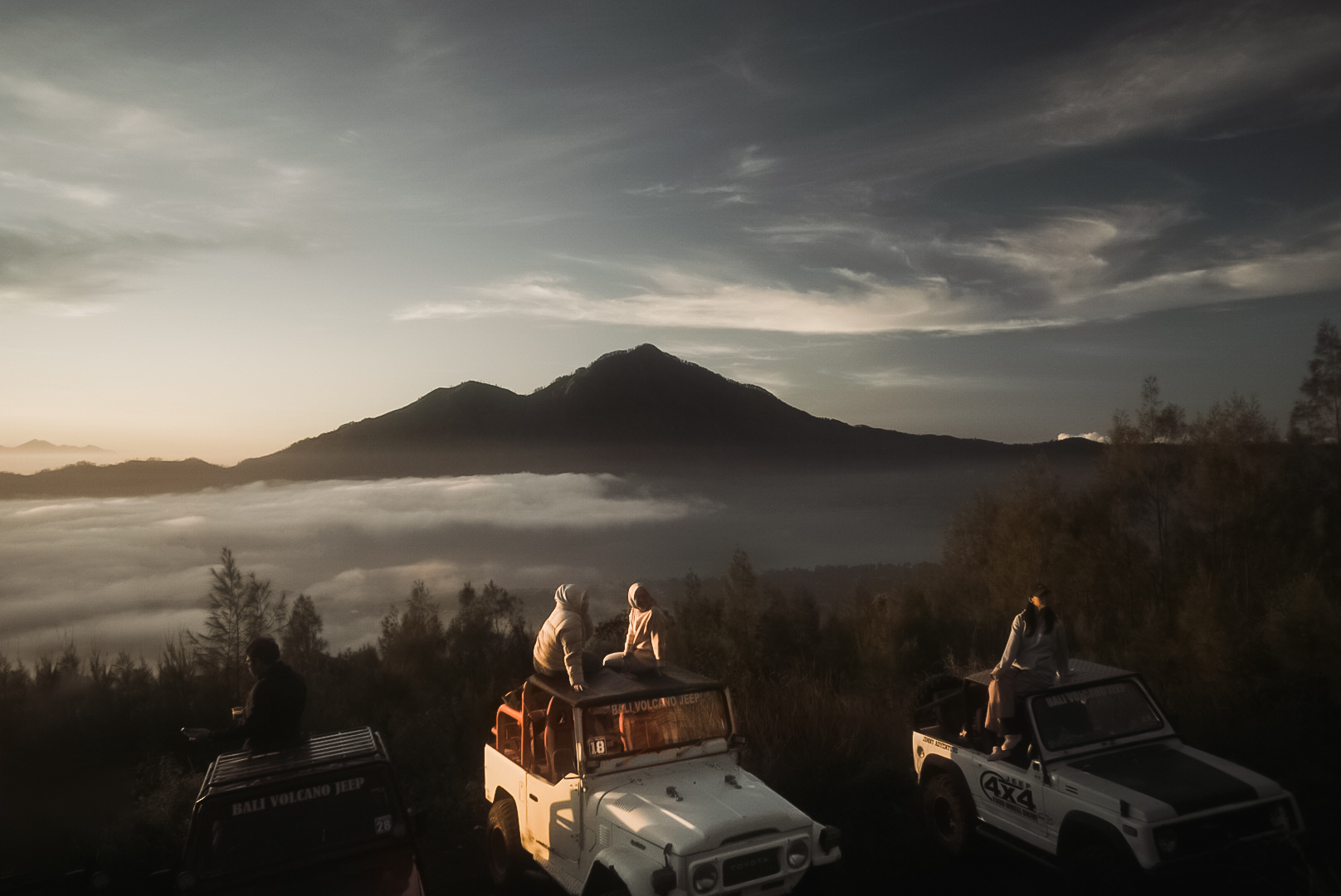 Off-road cars at sunrise